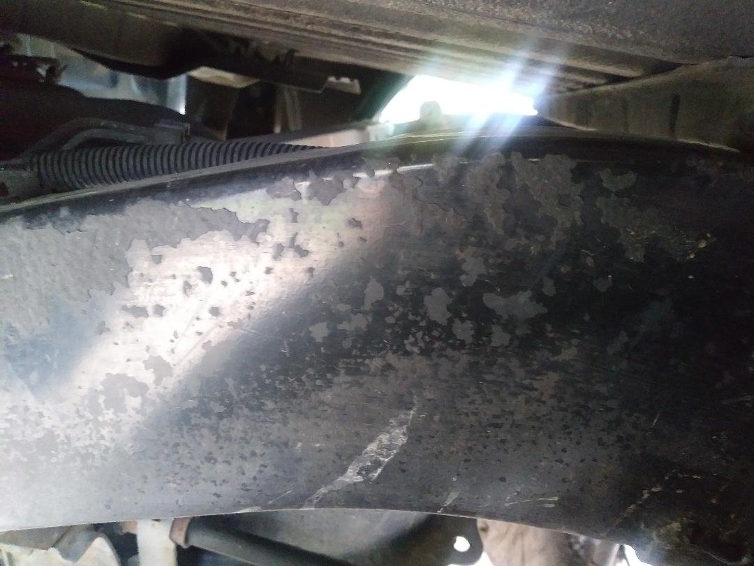 remnants of rubber undercoat driver side.jpg